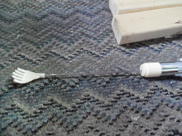 Vintage plastic battery operated back scratcher